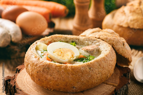 Traditional polish soup - zurek, served in bread loaf.