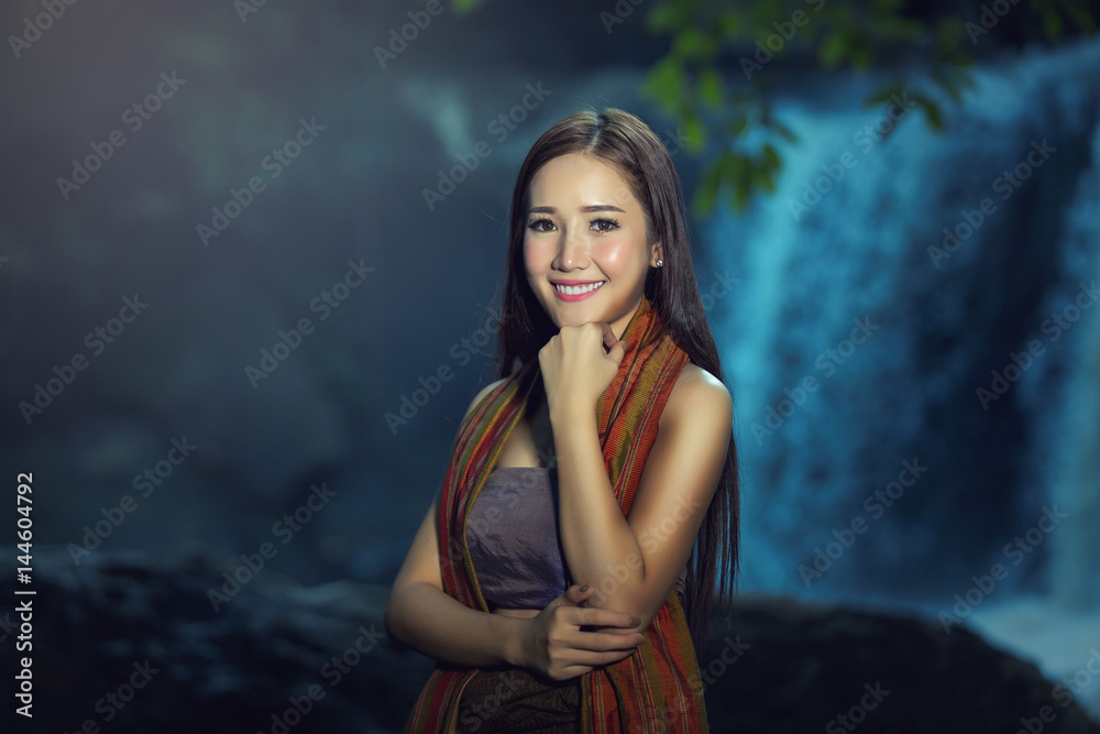 Fototapeta premium A portrait of a beautiful asian woman smiling brightly at the camera