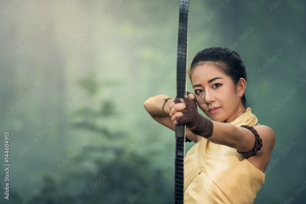 Beautiful young women archers practicing archery