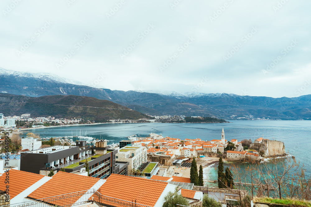 The Old Town of Budva, mountains covered with snow, Montenegro