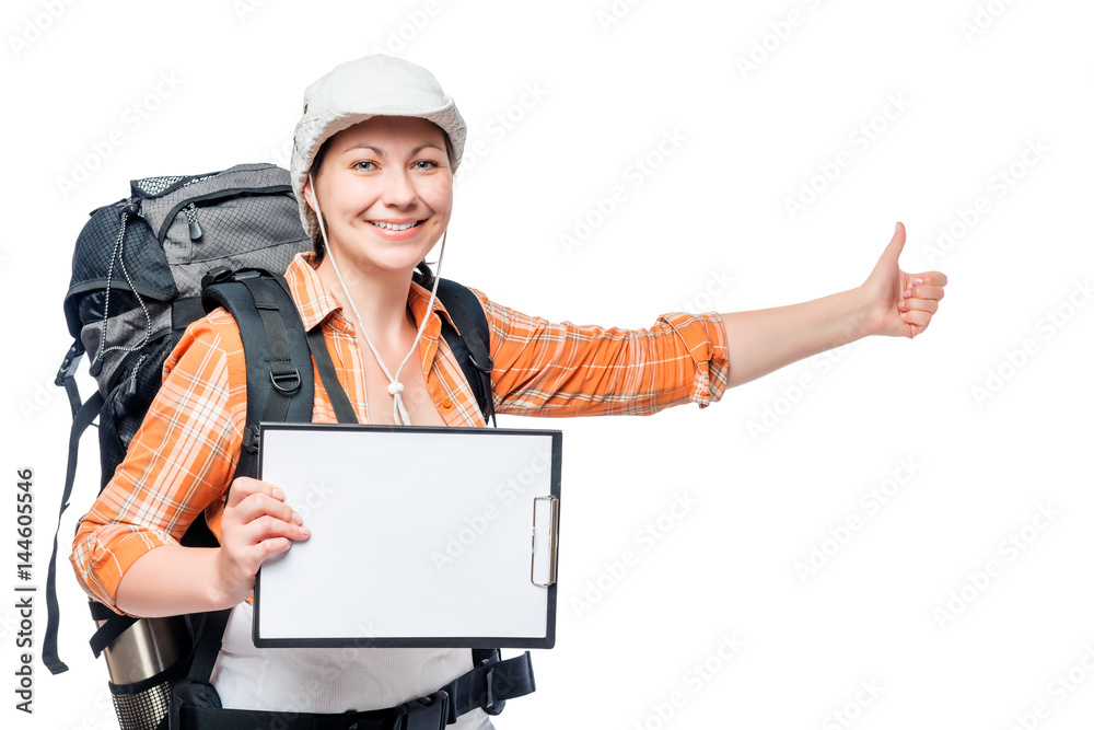young woman tourist hitchhiking travels with a blank in hands young woman tourist hitchhiking travels with a blank in hands