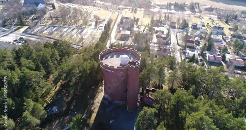 Halikko watertower, Cinema 4k aerial fly away tilt view of Halikko water tower, in Salo, Finland photo