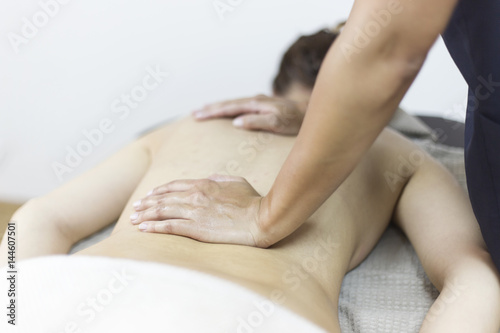 Woman having massage in the spa salon