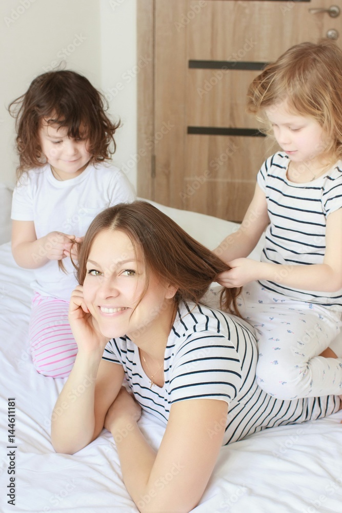 Happy loving family. Mother and her daughter child girl playing and hugging. Happy loving family. Mother and her daughter child girl playing and hugging.
