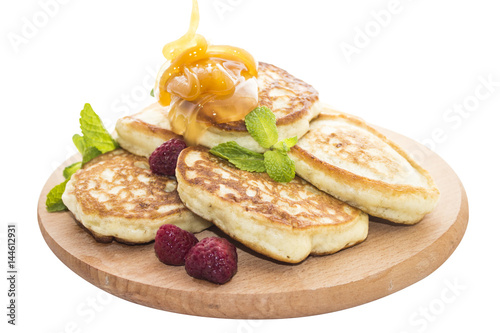 Cuadro en lienzo Cheese pancakes with raspberries and honey