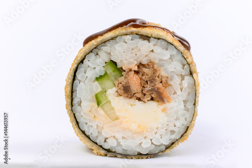 Japanese cuisine. One peace of sushi roll isolated on white background photo