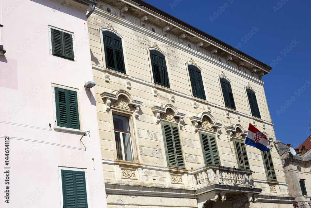 Old building with flag in Rovinj, Croatia