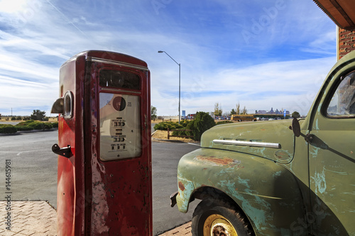 Vintage rusty truck on gas station in USA