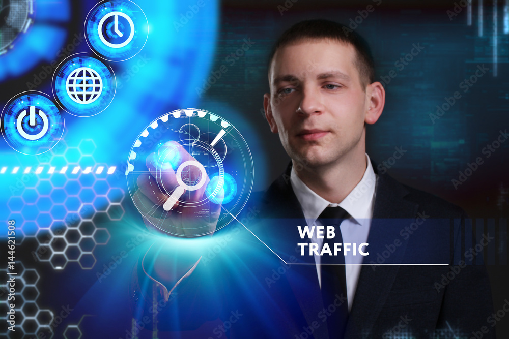 Business, Technology, Internet and network concept. Young businessman working on a virtual screen of the future and sees the inscription: Web traffic Business, Technology, Internet and network concept. Young businessman working on a virtual screen of the future and sees the inscription: Web traffic