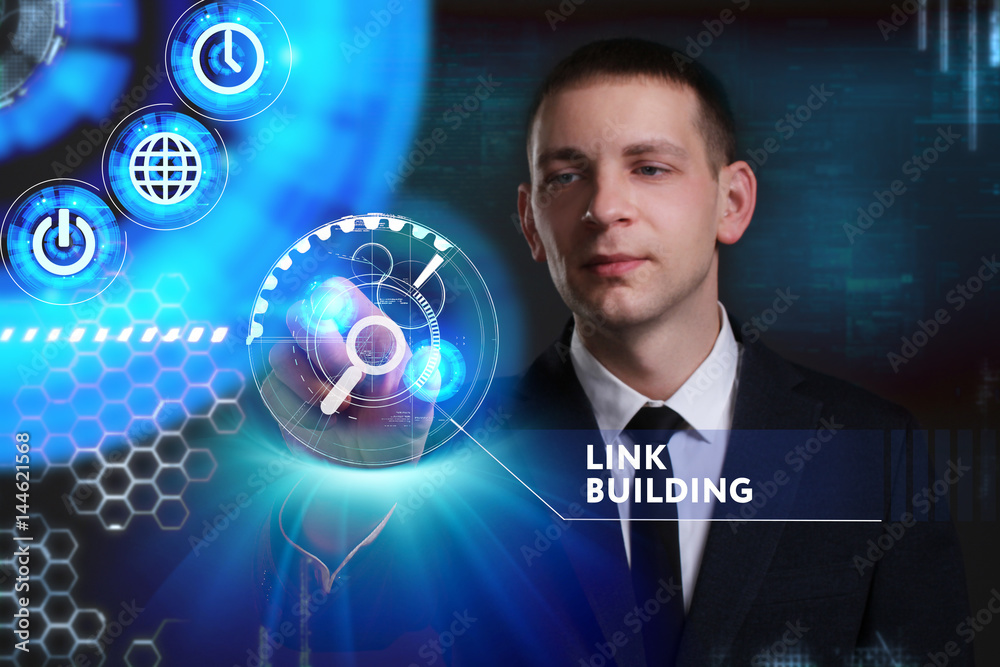 Business, Technology, Internet and network concept. Young businessman working on a virtual screen of the future and sees the inscription: Link building Business, Technology, Internet and network concept. Young businessman working on a virtual screen of the future and sees the inscription: Link building