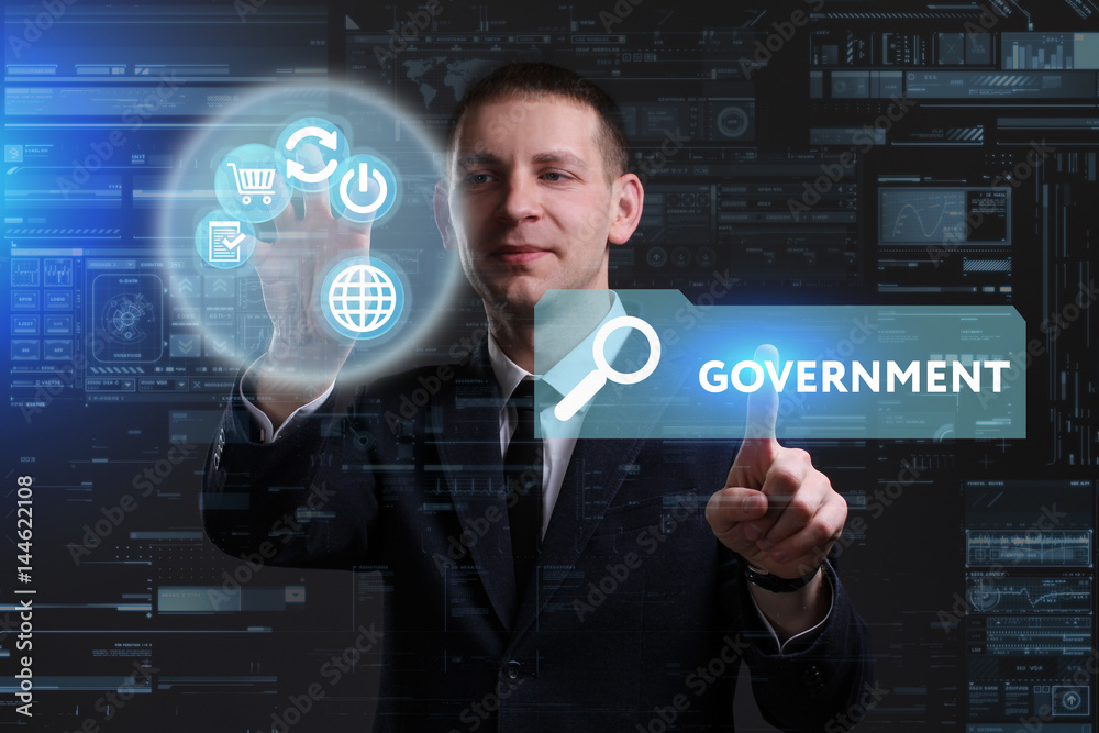 Business, Technology, Internet and network concept. Young businessman working on a virtual screen of the future and sees the inscription: Government