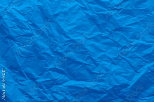 Background of a crumpled blue paper