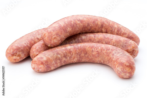 Raw sausage with parsley leaf isolated on white background.