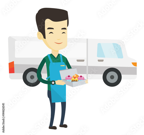 Delivery man holding a box of cakes.