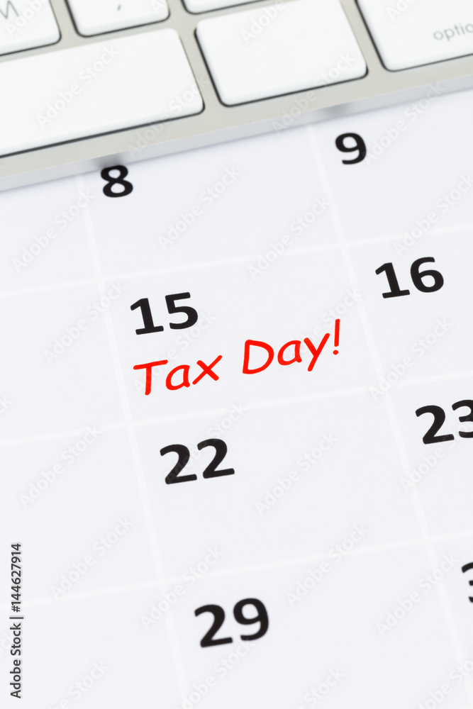 Tax day on calendar with keyboard Tax day on calendar with keyboard