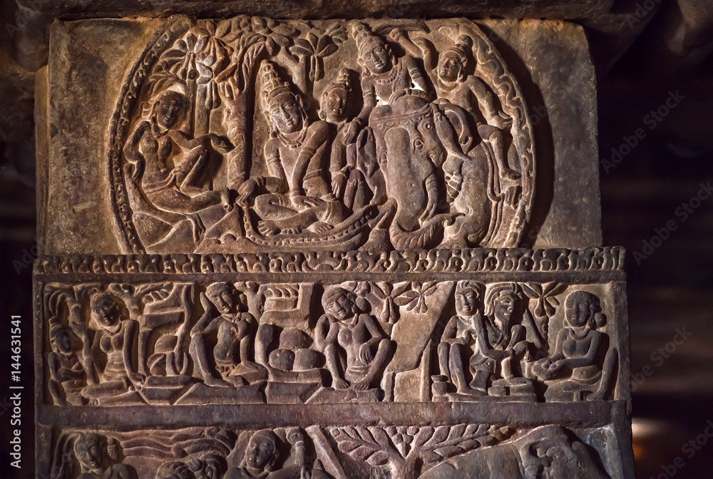 South Indian people and life in ancient villages, carved wall inside the 7th century temples in Pattadakal, India. UNESCO World Heritage site