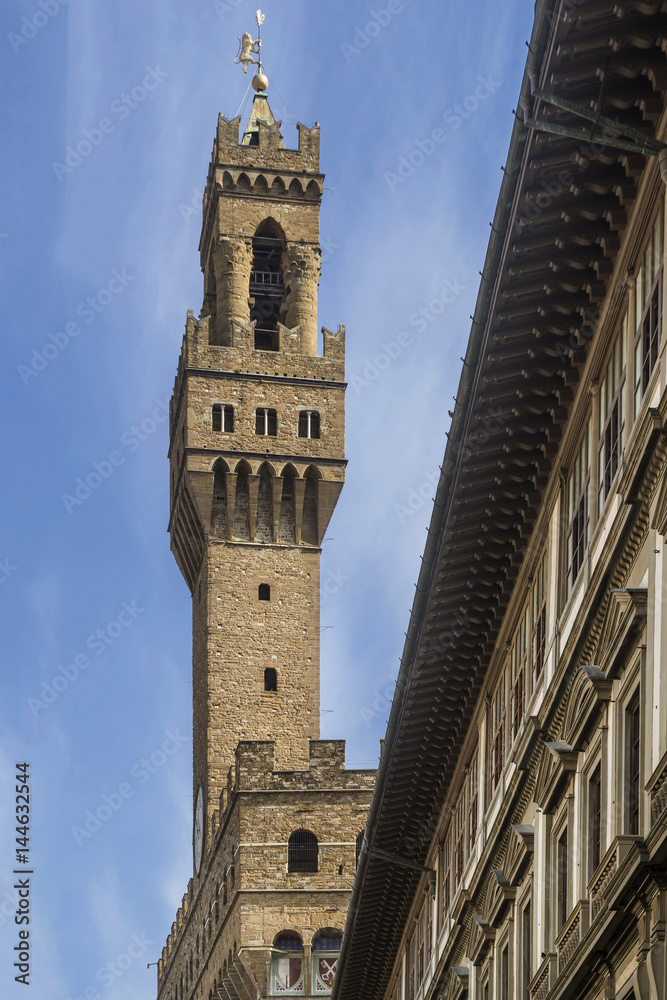 The Arnolfo tower of the Palazzo Vecchio palace, seen from the Uffizi Gallery, historic center of Florence, Italy