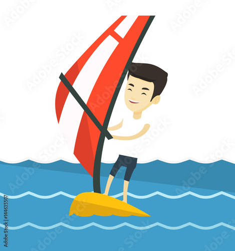 Young man windsurfing in the sea.