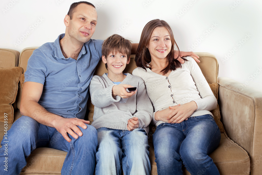 Happy family watching TV.