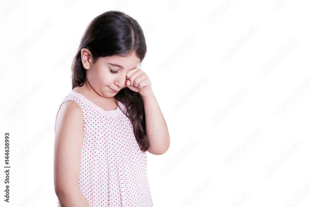 Sad crying unhappy small beautiful girl with dark hair and eyes. studio shot, isolated on white background. Sad crying unhappy small beautiful girl with dark hair and eyes. studio shot, isolated on white background.