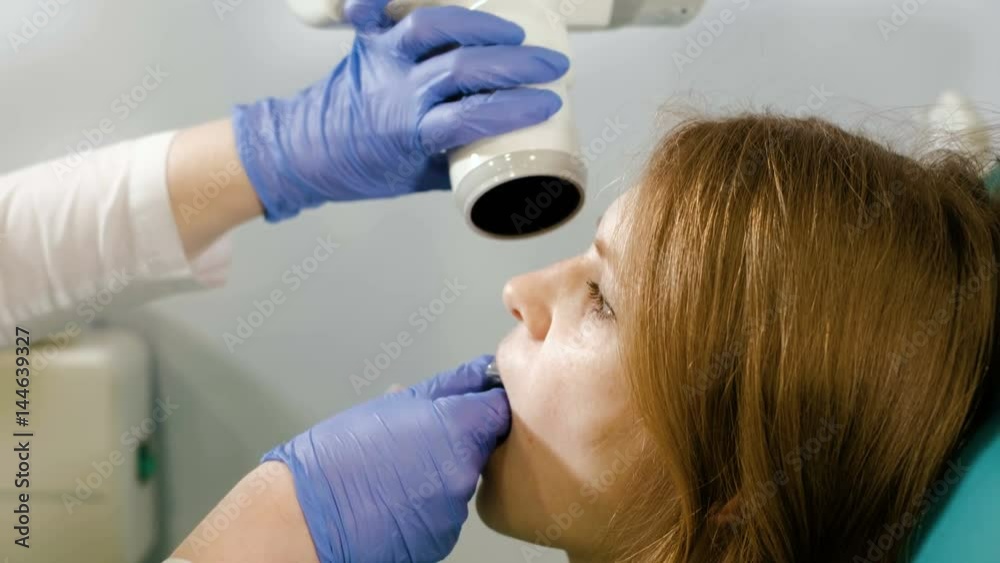 digital system equipment for dental diagnostic examination with patient woman in protective clothes 4k digital system equipment for dental diagnostic examination with patient woman in protective clothes 4k