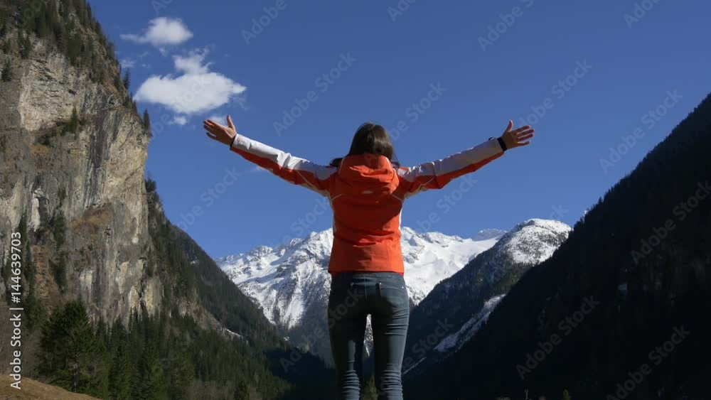 Woman enjoying amazing view of mountains Woman enjoying amazing view of mountains