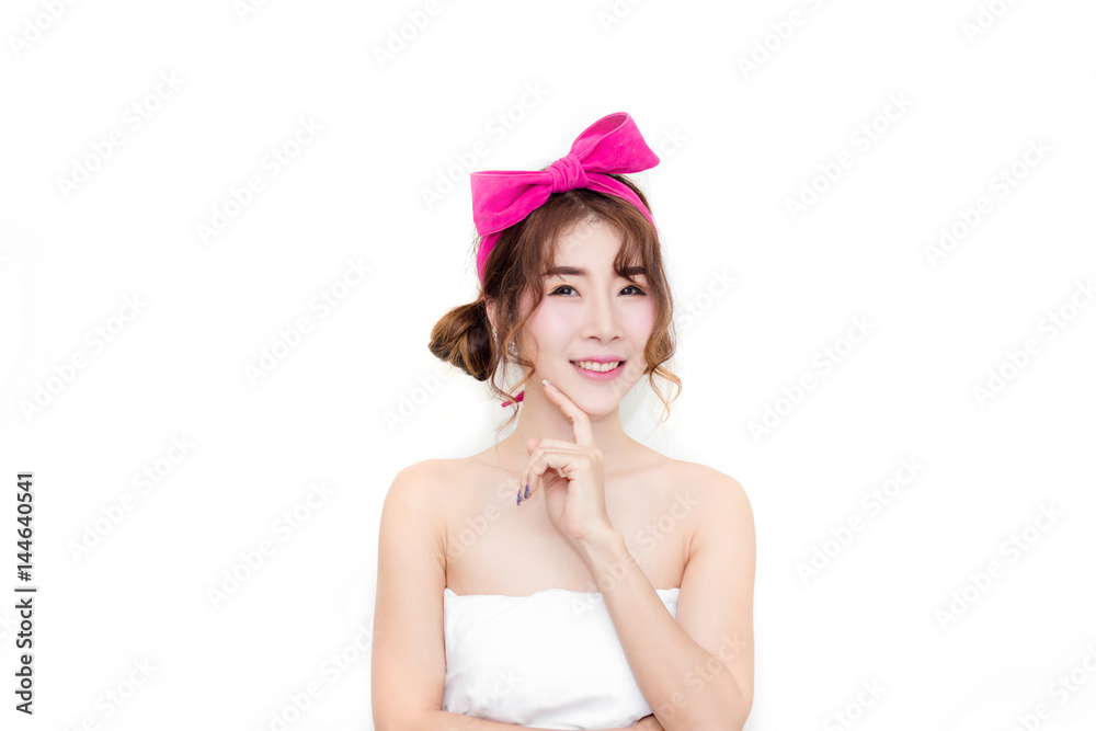 close up the beautiful woman asian look touch her face with pink bow on her hair close up the beautiful woman asian look touch her face with pink bow on her hair