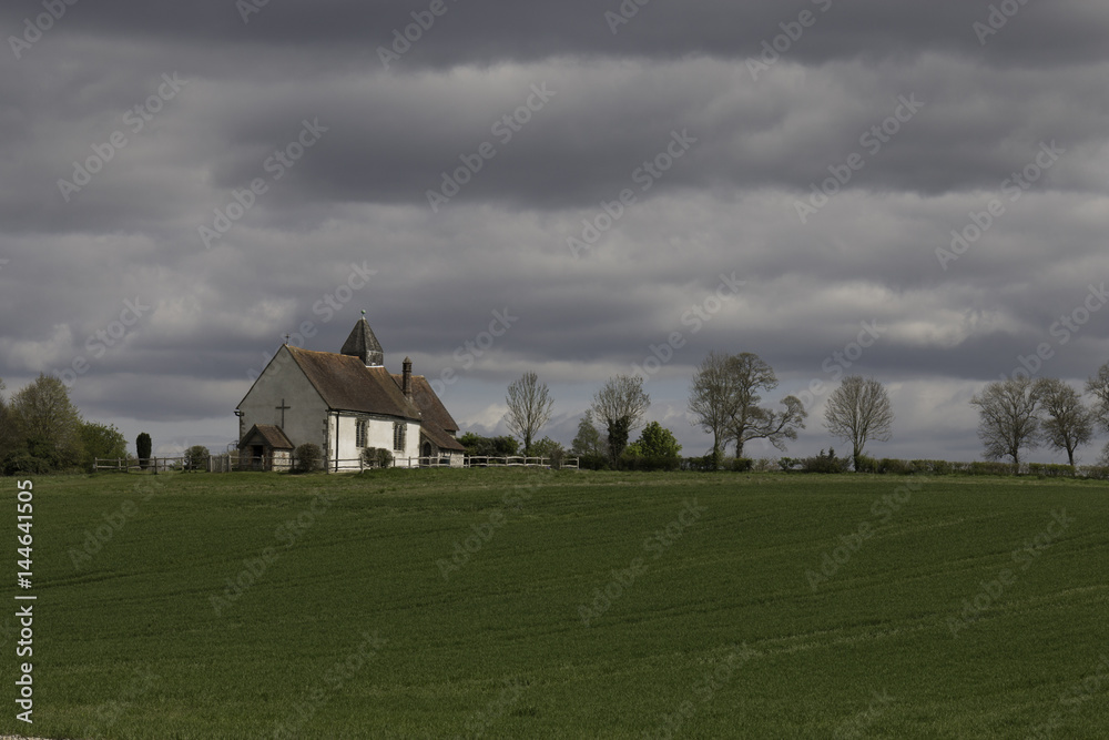 11th century church in a field, Hampshire, England