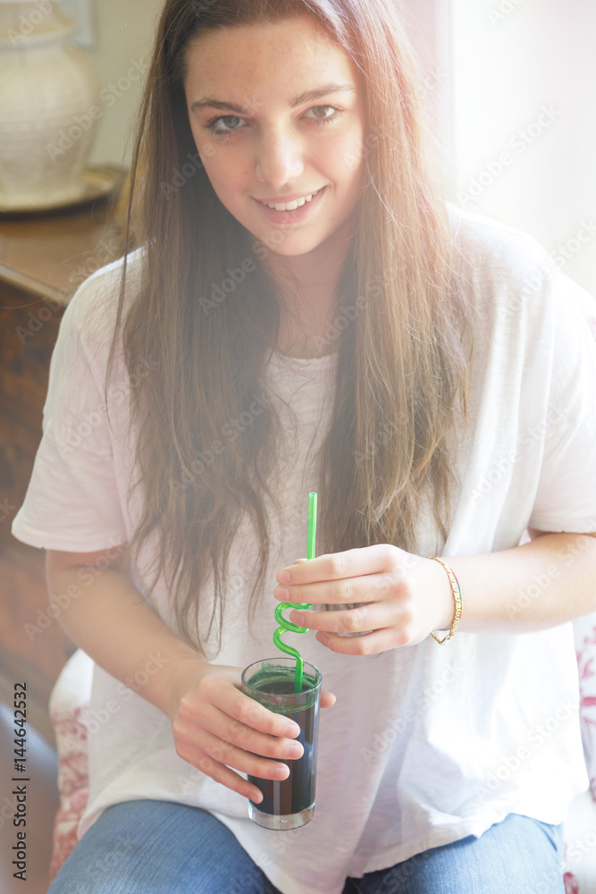 Young woman with refreshing drink