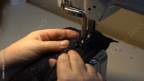 Dressmaker sewing clothes sewing machine needle