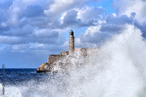 Waves breaking near the Malecon with Morro Castle in the background, Havana, Cuba