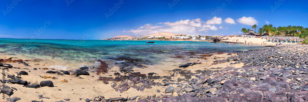 View to Costa Calma sandy beach with vulcanic mountains in the background on Fuerteventura island, Canary Islands, Spain. View to Costa Calma sandy beach with vulcanic mountains in the background on Fuerteventura island, Canary Islands, Spain.