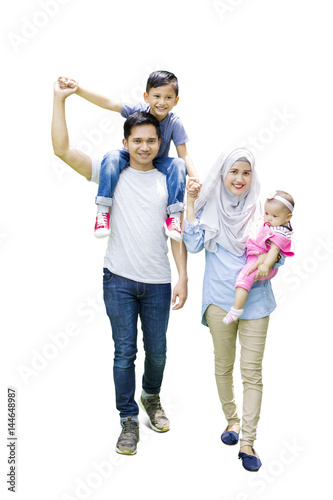 Muslim family walking in studio