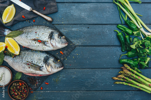 Fresh fish over wooden background 