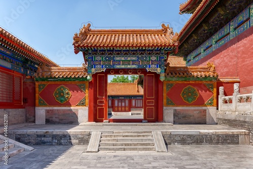 Gateway with red Chinese doors