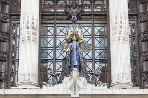 Statue and clock outside Selfridge's in London, UK photo