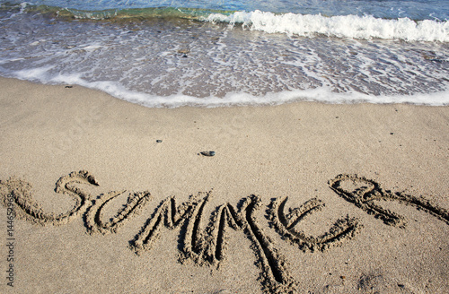summer text written on sand