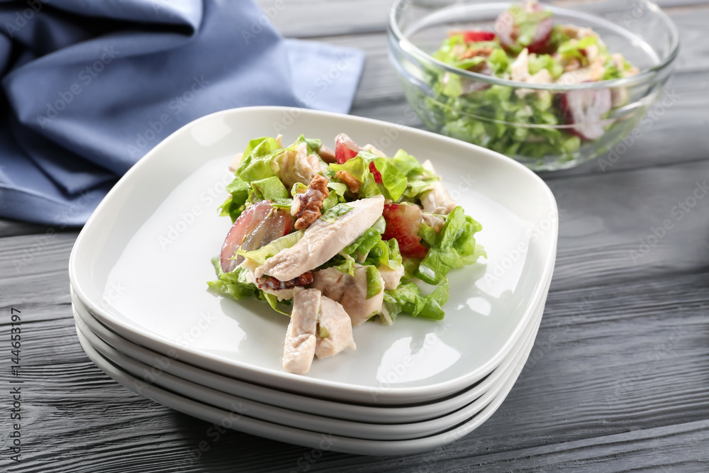 Plates with chicken salad and grapes on table Plates with chicken salad and grapes on table