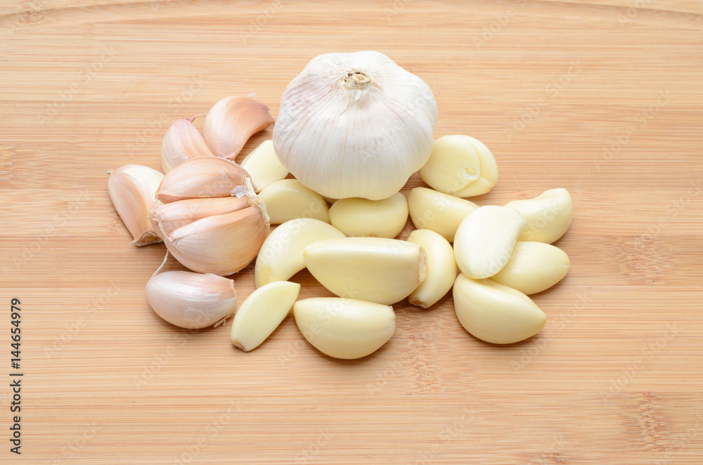 Fresh garlic on wood background Fresh garlic on wood background