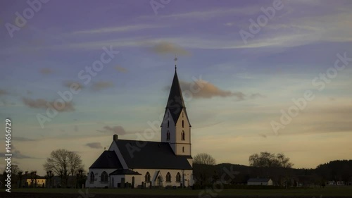 Timelapse of Swedish church in a rural area. photo