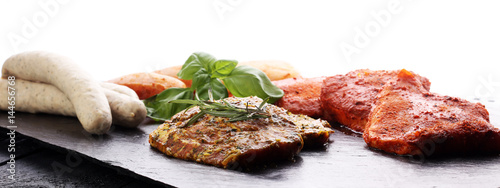Selection of marinaded meat for grilling and sausages
