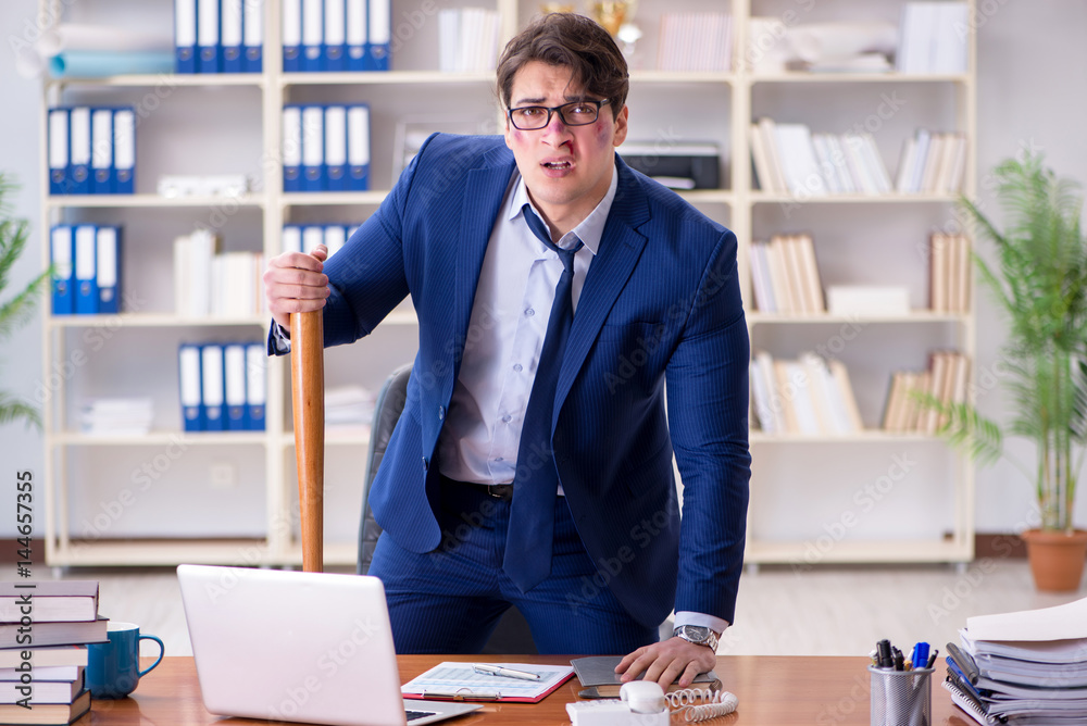 Angry aggressive businessman in the office