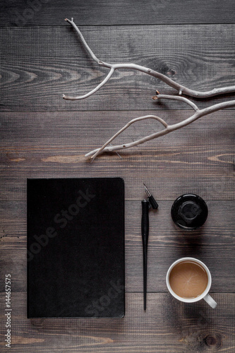 Writer workplace with tools on wooden background top view mock up
