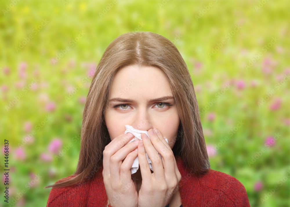 Young ill woman with tissue on white background Young ill woman with tissue on white background