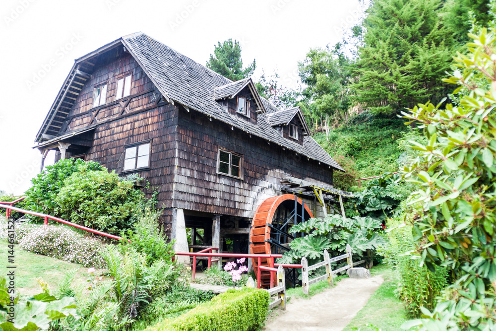 Old wooden water mill in Frutillar village, Chile Old wooden water mill in Frutillar village, Chile