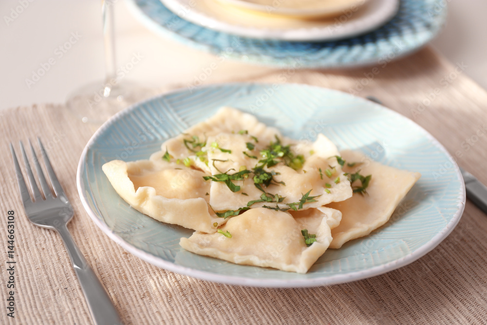 Plate with delicious ravioli on table Plate with delicious ravioli on table