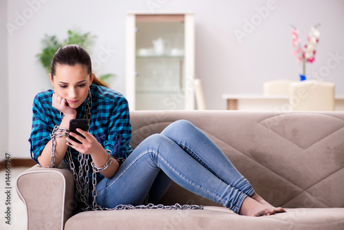 Young girl addicted to mobile phone