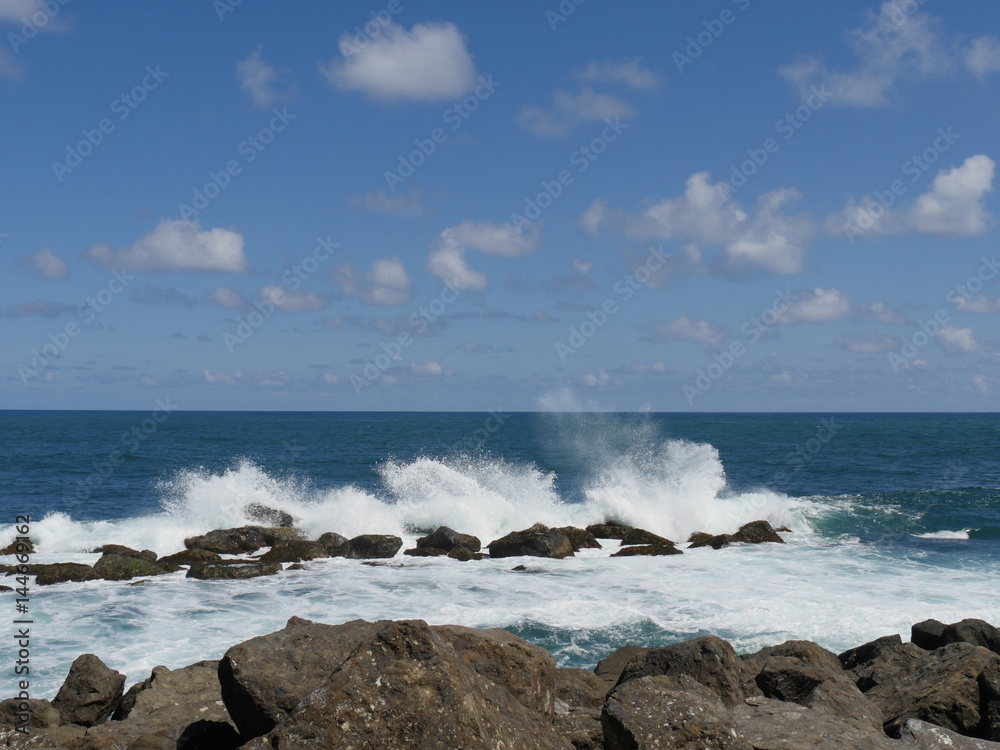 great waves against rocks white foaming waves crash against rocks creating huge showers great waves against rocks white foaming waves crash against rocks creating huge showers