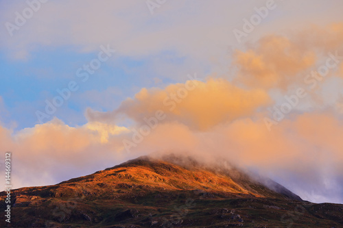 Beautiful mountain peak during sunset with dramatic cloud, Isle of Skye, Hightland, Scotland