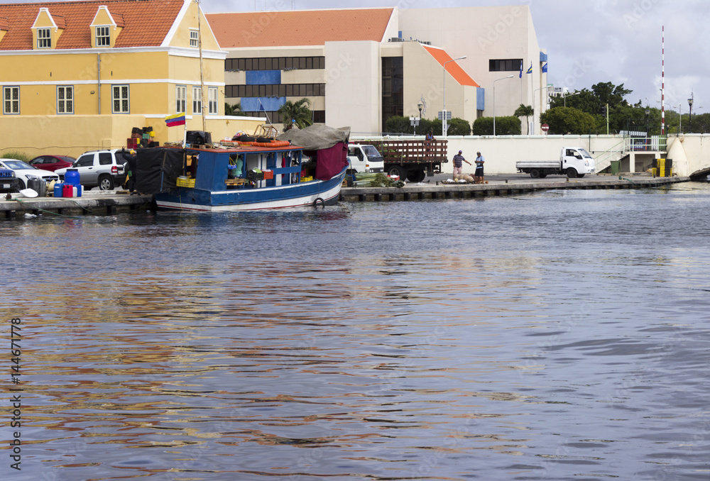 Boat moored behind Willemstad, Curacao's Floating Market.  Vendors travel from Venezuela on mainland South America to sell fresh produce and fish.